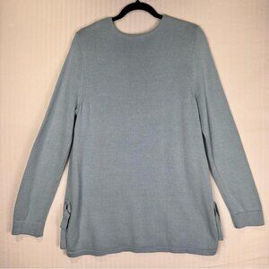 Stay cozy and stylish with this elegant blue sweater